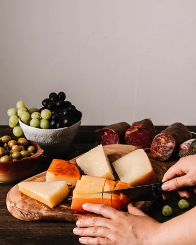 crop-hands-cutting-soft-cheese